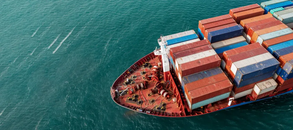Cargo ship carrying containers viewed from above